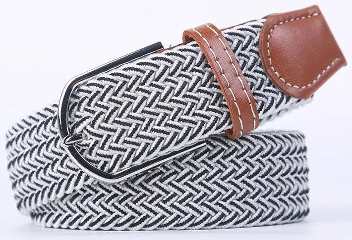 A woven elastic belt with a black and white herringbone pattern, brown leather accents, and a silver metal buckle, shown on a white background.