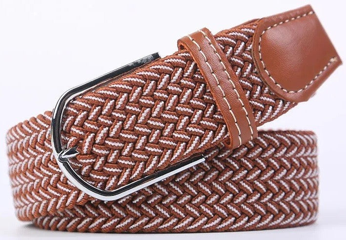 A woven elastic belt with a brown and white herringbone pattern, featuring a brown leather tip and a silver-tone metal buckle.