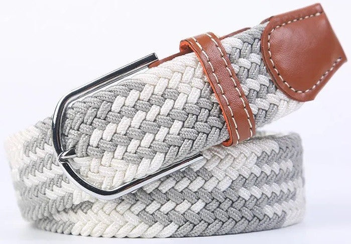A woven elastic belt with a gray and white braided pattern, a brown leather keeper loop, and a silver metal buckle, shown on a white background.